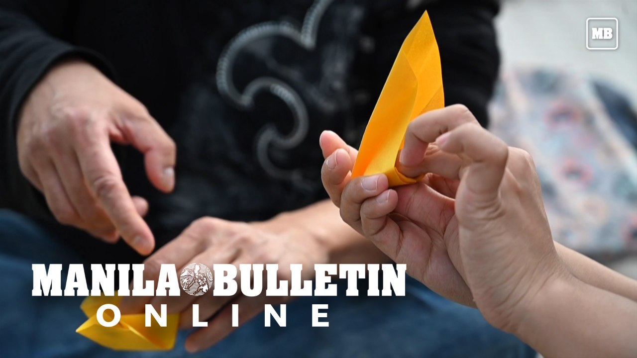 Social workers fold origami helmets in support of Hong Kong protests