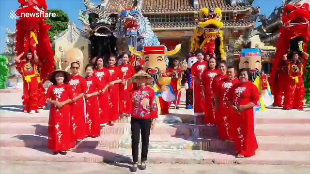 Circus acrobats help retrieve reporter's drone from the top of utility pole