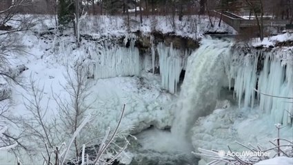 Minnehaha Falls partially frozen due to frigid cold conditions