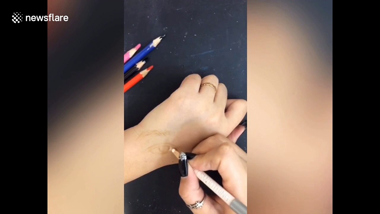 Chinese art teacher draws incredibly realistic facial features ON HER ARM