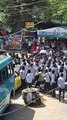 RSS goons throwing soda bottles and plastic containers at school students who...