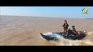 Boy holding Python in the boat Floating Village Tonle Sap Lake Siem Reap Cambodia by Ivision Ireland