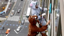 Japanese window cleaners celebrate 2020 being the Year of the Rat by dressing up in animal costumes
