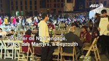 Des militants libanais célèbrent le dîner de Noël sur la Place des Martyrs