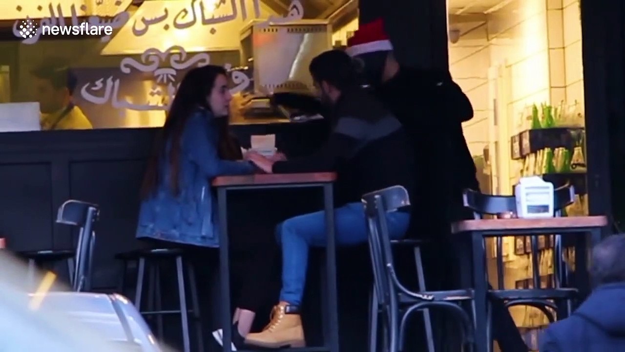 Watch people on the streets of Beirut get pranked with photoshopped snaps of themselves at Christmas time