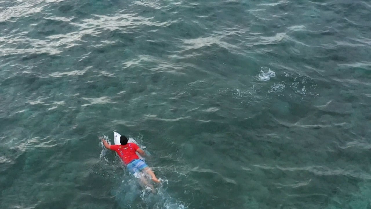 15 years on, Indonesian surfer rides the waves to beat tsunami trauma