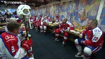Putin dons skates to play ice hockey in Moscow