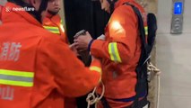 Chinese firefighters rescue worker who accidentally fell into elevator shaft