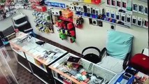 Security cam captures moment thieves clean out mobile phone store