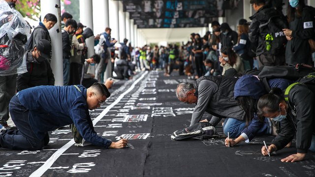 Thousands gather in rain for peaceful anti-government rally in downtown Hong Kong