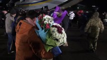 Ukrainian President Volodymyr Zelensky greets former prisoners at Kiev airport