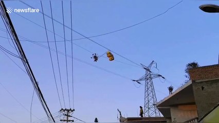 Chinese paraglider rescued after parachute becomes tangled on high-voltage power lines