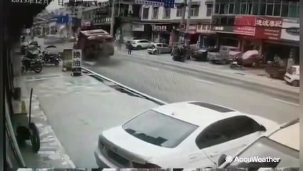Sinkhole opens up in middle of road, swallowing truck