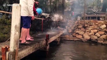 Family forced to shelter on boat for more than 10 hours as wildfires sweep through Australian town of Mallacoota