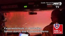Australien: Feuerwehrleute fahren durch das Inferno
