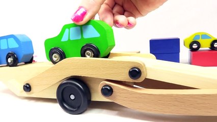 Colors for kids with a car transporter & toy cars.