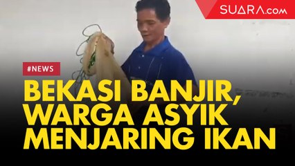 Bekasi Banjir Besar, Warga Malah Asik Menjaring Ikan