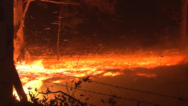 Australia fires: thousands take refuge on beaches and boats as deadly flames rip through towns