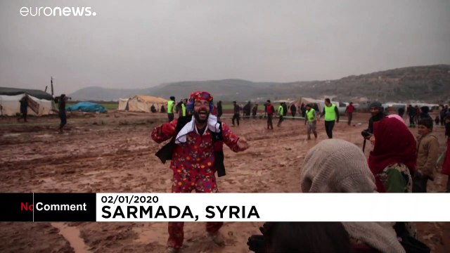 Displaced Syrians enjoy a game of football in jihadist-run region