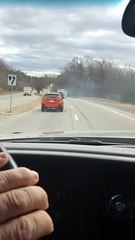 Truck Hauling a Smoking Structure