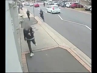 Security Camera: Bizarre moment police chase down fugitive wearing SANTA HATS