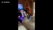 Hilarious Christmas moment when Arizona woman grabs on to her nephew to prevent herself from falling off a hoverboard