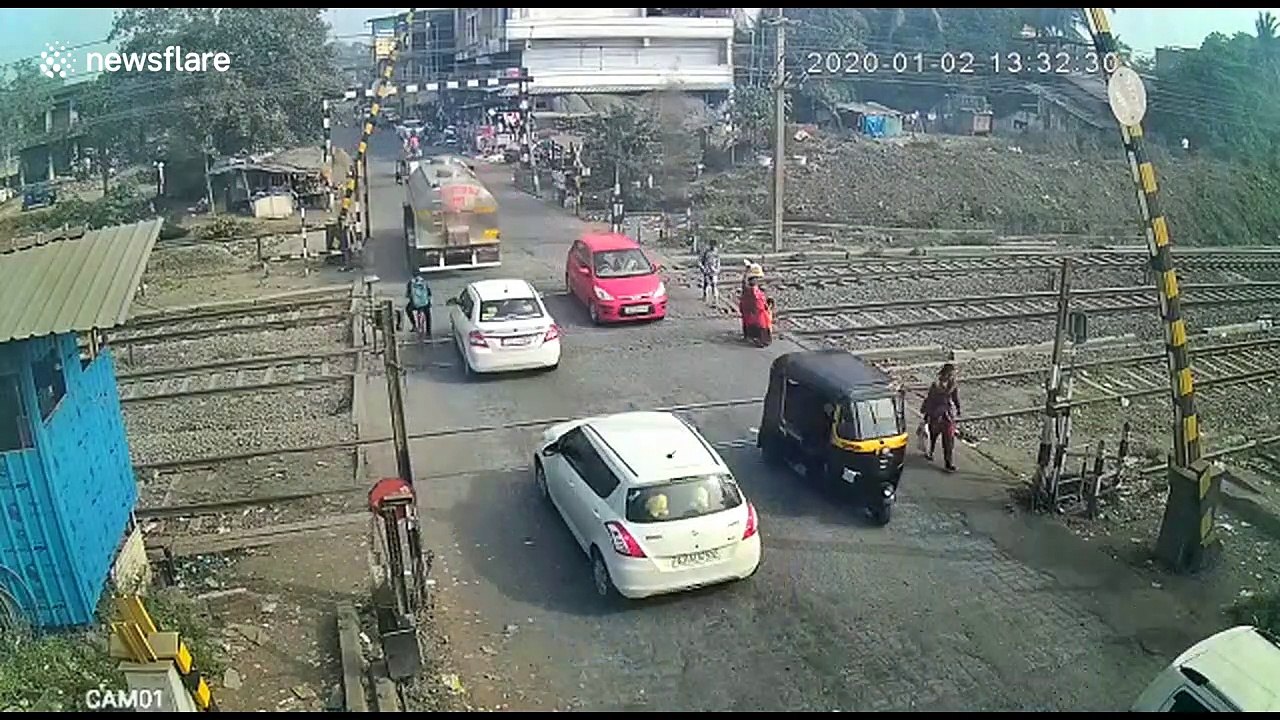 Security cam captures moment biker slams into barrier at level crossing