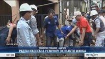 Partai NasDem dan Pemprov DKI Bantu Warga Bersih-bersih Sisa Banjir di Pondok Pinang