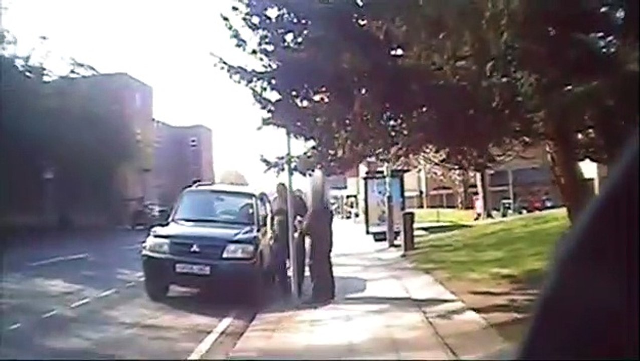 See the shocking moment man drives his car at traffic warden in row over ticket