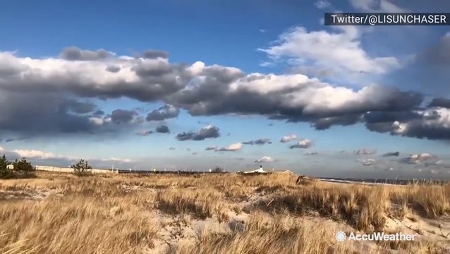 Harsh winds and stormy clouds looming over the beach