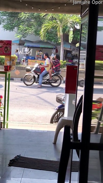 Person Playing with a Puppy on a Scooter