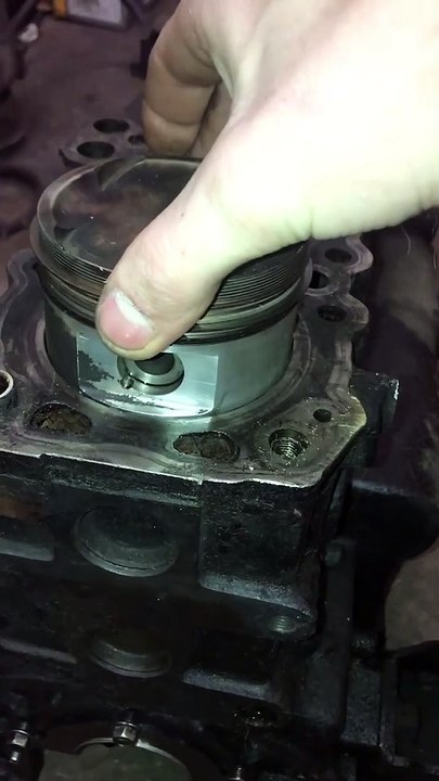 Installing a Piston into an Engine with a Hammer