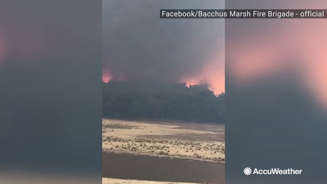 Smoke from wildfire billows into the air