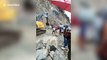 Car crushed by huge boulders while driving on north Indian mountain road
