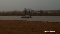 Insane levels of water leave car trapped