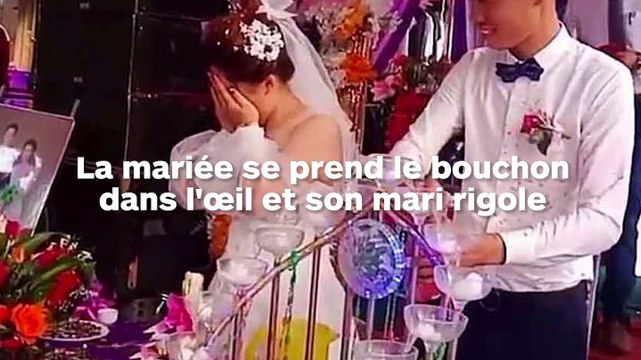 Le bouchon explose dans l'œil de la marié et son mari rigole