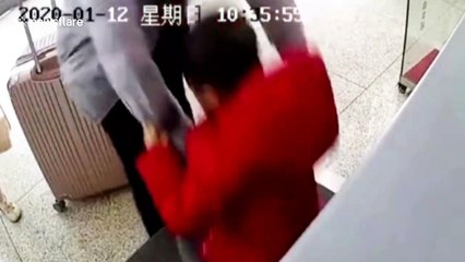 Hurried Chinese father accidentally puts his son onto security scanner conveyor belt at train station