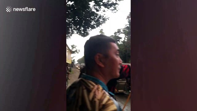 Volcanic ash covers cars in the Philippines after Taal volcano erupts