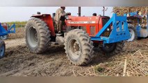 Mf 460 4x4 pushing a stuck sugarcane trolley |  two Mf 385 and Mf460 4x4 pulling out a loaded troly