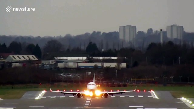 Planes battle against crosswinds from Storm Brendan as they land at Birmingham Airport