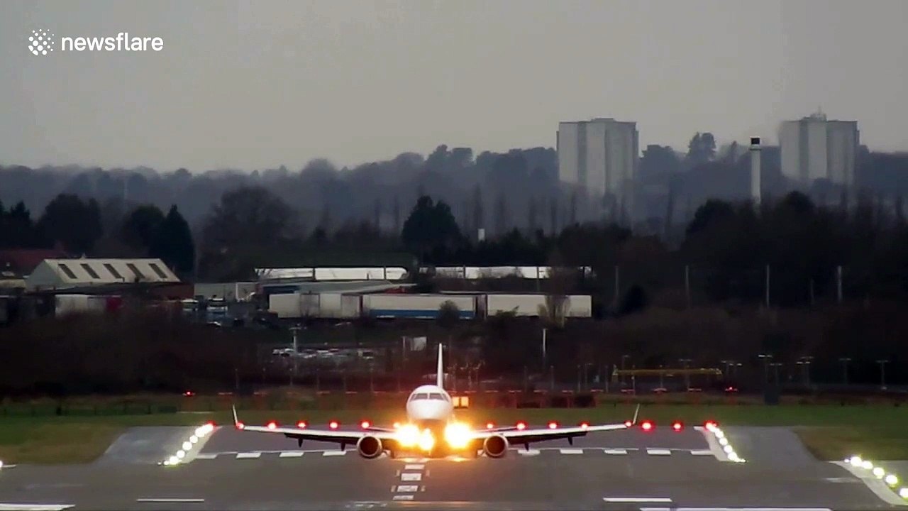Planes battle against crosswinds from Storm Brendan as they land at Birmingham Airport