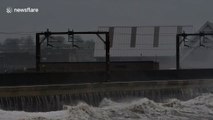 Waves crash into Ayrshire coastline as Storm Brendan blows across Scotland