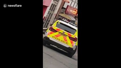 Moment police arrest man with packages strapped to his body in Derby city centre