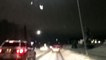 Moose Crosses through Traffic on Icy Road