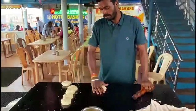 Talented Indian chef tosses chapatis across kitchen to his baker like it's nothing