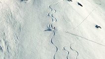 Skiers Create Mesmerizing Patterns On Fresh Powder