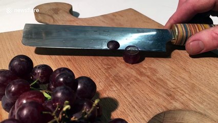 Incredibly sharp knife slices grape with super-satisfying ease