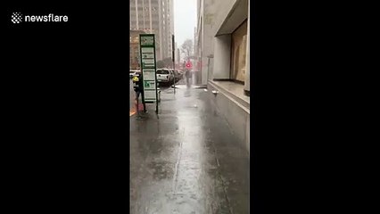 Water burst from the ground during heavy rain in San Francisco