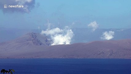 Steam is seen rising from the crater of the recently erupted Taal volcano