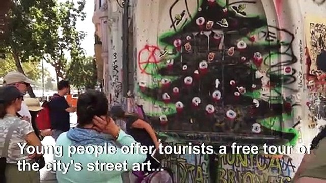 Chilean guides explain protests to tourists through street art tour